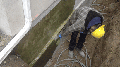 Worker waterproofing foundation